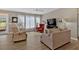 Comfortable living room featuring bright windows, hardwood floors, and a ceiling fan at 127 Laurel Farms Ln, Dallas, GA 30157
