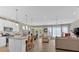 Open-concept living space featuring a kitchen island, dining area, and comfortable seating at 127 Laurel Farms Ln, Dallas, GA 30157