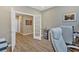 This office features French doors, hardwood floors, a modern desk, and neutral paint at 127 Laurel Farms Ln, Dallas, GA 30157
