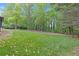 Expansive grassy backyard with lush trees providing plenty of shade and privacy at 1391 Arden Sw Dr, Marietta, GA 30008