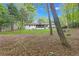 Expansive backyard features mature trees and a covered patio, perfect for outdoor entertaining at 1391 Arden Sw Dr, Marietta, GA 30008