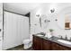 Elegant bathroom featuring double sinks, decorative mirrors, and a shower with a curtain at 1391 Arden Sw Dr, Marietta, GA 30008