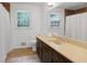 Bathroom with a dual sink vanity, modern fixtures, and ample natural light at 1391 Arden Sw Dr, Marietta, GA 30008