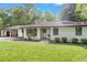 Attractive single-story home with neat landscaping and a convenient attached carport at 1391 Arden Sw Dr, Marietta, GA 30008