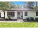 Inviting home featuring a bay window and neatly manicured landscaping around the front entrance at 1391 Arden Sw Dr, Marietta, GA 30008
