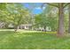 Welcoming home with a large lawn, mature trees, and a convenient two-car carport at 1391 Arden Sw Dr, Marietta, GA 30008