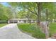 Inviting home with a stone mailbox and a wide driveway leading to a convenient carport at 1391 Arden Sw Dr, Marietta, GA 30008