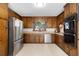 Well-equipped kitchen featuring wood cabinets, stainless steel appliances, and ample counter space at 1391 Arden Sw Dr, Marietta, GA 30008