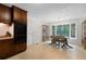 Bright kitchen with wood cabinets, stainless steel appliances, and a dining area with large windows at 1391 Arden Sw Dr, Marietta, GA 30008
