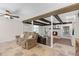 Comfortable living space with a stone fireplace, wood floors, and exposed beam details at 1391 Arden Sw Dr, Marietta, GA 30008