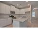 Modern kitchen featuring white cabinetry, stainless appliances, and granite countertops at 492 Charleston Pl, Villa Rica, GA 30180