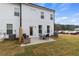 Large backyard with patio area and seating, ideal for relaxing and socializing at 8214 Tiger Way, Riverdale, GA 30296