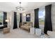 Charming Bedroom with a gold crib, modern light fixture, and soft, neutral decor at 8214 Tiger Way, Riverdale, GA 30296