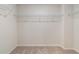 Walk-in closet with carpet flooring and shelving for optimal storage at 8214 Tiger Way, Riverdale, GA 30296