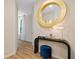 Stylish foyer with a round mirror, modern table, and a glimpse of the interior design at 8214 Tiger Way, Riverdale, GA 30296