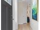 Welcoming entryway with wood floors, white trim, and a view into a bright, modern home at 8214 Tiger Way, Riverdale, GA 30296