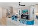 Open-concept living room boasts hardwood floors, natural light, and comfortable seating at 8214 Tiger Way, Riverdale, GA 30296