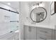 Beautiful bathroom featuring tiled shower, modern vanity, and stylish fixtures at 113 Courtyard Ter, Roswell, GA 30075