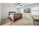 Cozy bedroom with carpet, ceiling fan and bright natural light from the windows at 113 Courtyard Ter, Roswell, GA 30075