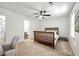 Comfortable bedroom featuring carpet, ceiling fan and ensuite bathroom at 113 Courtyard Ter, Roswell, GA 30075