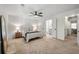 Comfortable bedroom with carpet, ceiling fan and access to bathroom and hallway at 113 Courtyard Ter, Roswell, GA 30075