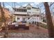 Expansive backyard with a firepit, screened-in porch and multi-level decks at 1584 Fernstone Nw Cir, Acworth, GA 30101