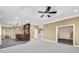 A large basement includes a bar, neutral paint and flooring, and a ceiling fan at 1584 Fernstone Nw Cir, Acworth, GA 30101