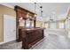 Basement includes a wooden bar with decorative lighting at 1584 Fernstone Nw Cir, Acworth, GA 30101