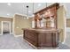 Basement includes an ornate wooden bar with lighting at 1584 Fernstone Nw Cir, Acworth, GA 30101