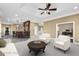 Spacious staged basement with a bar, two chairs, and good lighting at 1584 Fernstone Nw Cir, Acworth, GA 30101