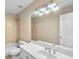 Bathroom featuring a double sink vanity, tub with shower, and a large mirror at 1584 Fernstone Nw Cir, Acworth, GA 30101
