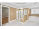 Bathroom featuring a glass shower, soaking tub, tiled floor, and window at 1584 Fernstone Nw Cir, Acworth, GA 30101