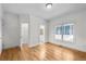 This bedroom features hardwood floors, large windows, and access to an ensuite bathroom at 1584 Fernstone Nw Cir, Acworth, GA 30101