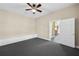 Bedroom with ceiling fan, storage, and grey carpet at 1584 Fernstone Nw Cir, Acworth, GA 30101