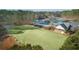 Aerial view of community amenities, including a pool and tennis court at 1584 Fernstone Nw Cir, Acworth, GA 30101