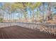 Deck with painted white railing and wooded view at 1584 Fernstone Nw Cir, Acworth, GA 30101