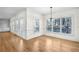 Elegant dining space featuring hardwood floors, large windows, and access to the outdoors at 1584 Fernstone Nw Cir, Acworth, GA 30101