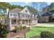 Traditional two-story home with a stone and siding facade, complemented by a well-manicured lawn at 1584 Fernstone Nw Cir, Acworth, GA 30101