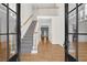 Grand foyer with hardwood floors, staircase, and high ceilings at 1584 Fernstone Nw Cir, Acworth, GA 30101