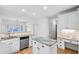 Bright kitchen features granite counters, stainless steel appliances and white cabinets at 1584 Fernstone Nw Cir, Acworth, GA 30101