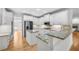 Gourmet kitchen featuring granite countertops, stainless steel appliances, and white cabinetry at 1584 Fernstone Nw Cir, Acworth, GA 30101