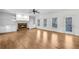Spacious living room featuring a fireplace, built-in shelves, and wood floors at 1584 Fernstone Nw Cir, Acworth, GA 30101