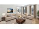 Bright living room with neutral furniture, hardwood floors, and natural light at 1584 Fernstone Nw Cir, Acworth, GA 30101