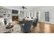 Cozy living room with built-in shelves, a fireplace, and a door to the outside deck at 1584 Fernstone Nw Cir, Acworth, GA 30101