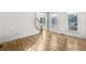Bright living area featuring hardwood floors, white walls, and large windows at 1584 Fernstone Nw Cir, Acworth, GA 30101
