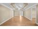 Bright primary bedroom features hardwood floors, tray ceiling, and an open walk-in closet at 1584 Fernstone Nw Cir, Acworth, GA 30101
