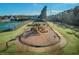 A lovely playground is surrounded by a walking path and benches at 1584 Fernstone Nw Cir, Acworth, GA 30101