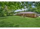 Expansive backyard featuring a well-maintained lawn and the brick exterior of the residence at 1652 Detroit Nw Ave, Atlanta, GA 30314