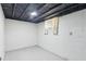 Basement area featuring painted walls and ceiling with a small window at 1652 Detroit Nw Ave, Atlanta, GA 30314