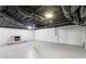 Basement featuring exposed ceiling, fireplace, and potential for customization at 1652 Detroit Nw Ave, Atlanta, GA 30314